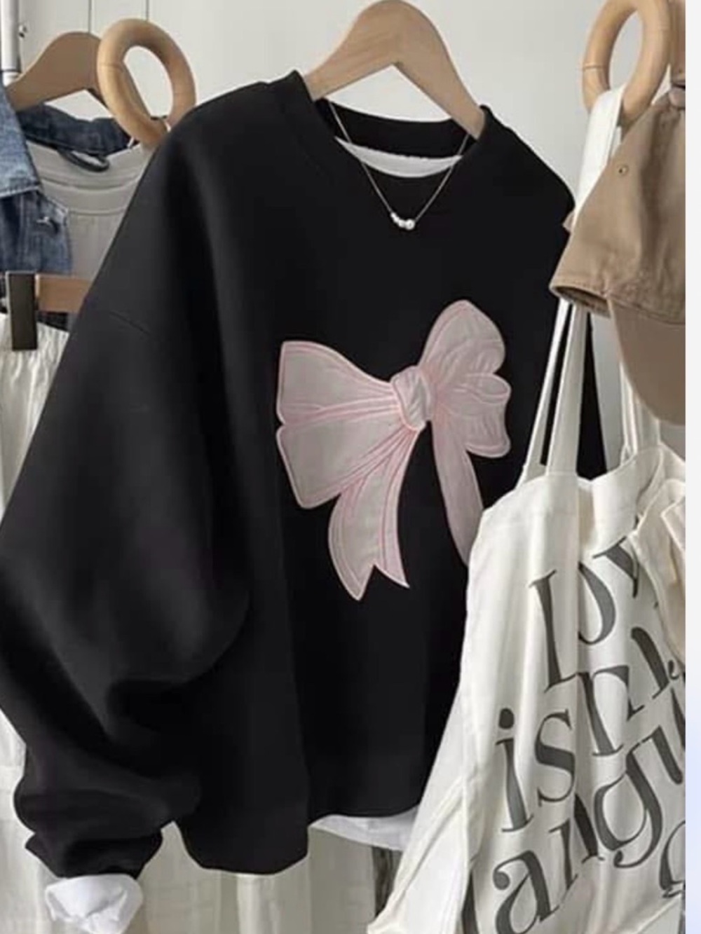 Women’s Black Crewneck Sweatshirt with Pink Bow